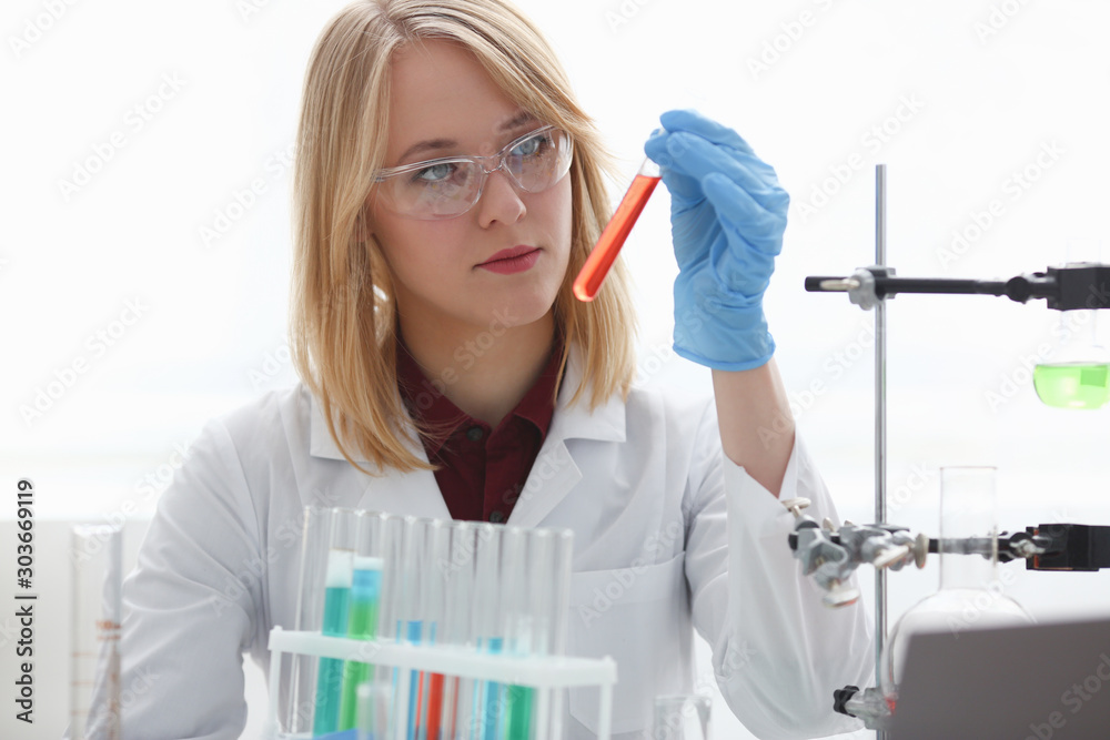 Technician hold in arms in protective gloves Technician hold in arms in protective gloves