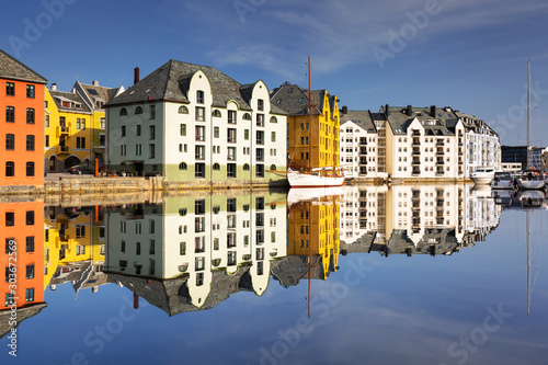 Colorful architecture of Alesund reflected in the water, Norway