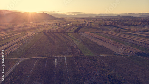 Aerial view of autumn fields at sunset.