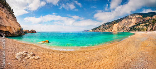 Panoramic view of Myrtos Beach. Sunny morning scene of Cephalonia island, Divarata village location, Greece, Europe. Exciting summer seascape of Ionian Sea. Beauty of nature concept background.