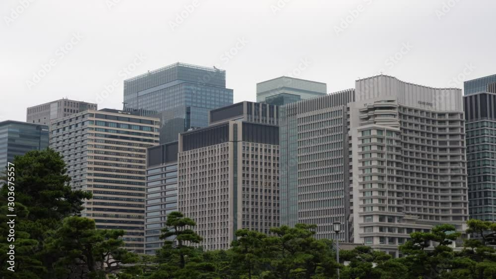 Tokyo city skyline view from Imperial Palace gardens. PANNING RIGHT Tokyo city skyline view from Imperial Palace gardens. PANNING RIGHT