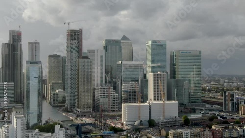 Aerial drone close up view of Canary Wharf Central Business District Towers of London's Docklands Isle of Dogs Canada Square Skyline  photo