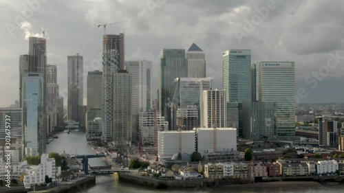 Aerial drone close up view of Canary Wharf Central Business District Towers of London's Docklands Isle of Dogs Canada Square Skyline  photo