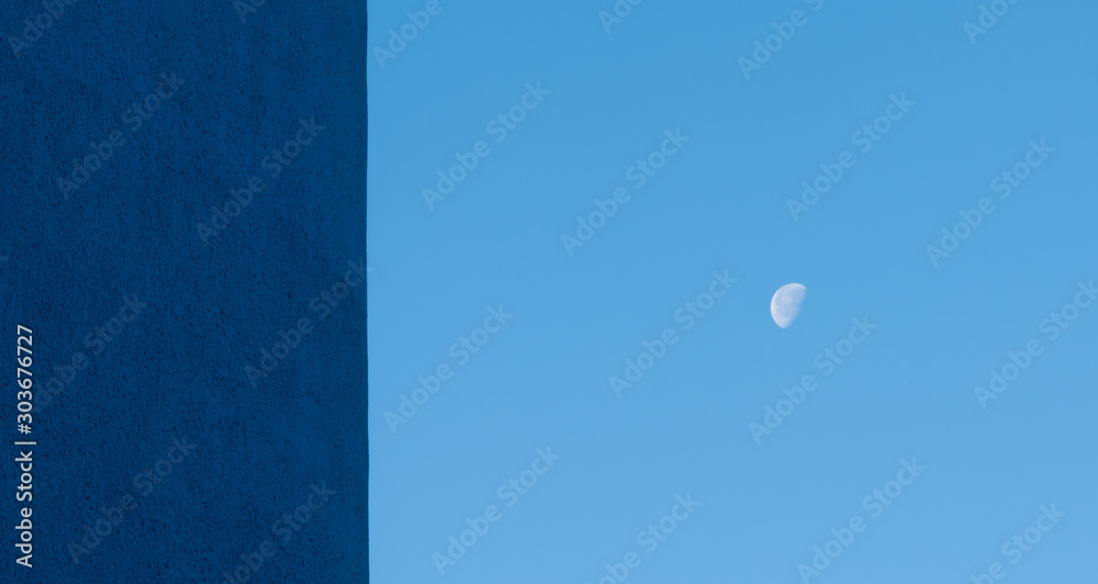 Half moon and blue facade in the morning Half moon and blue facade in the morning