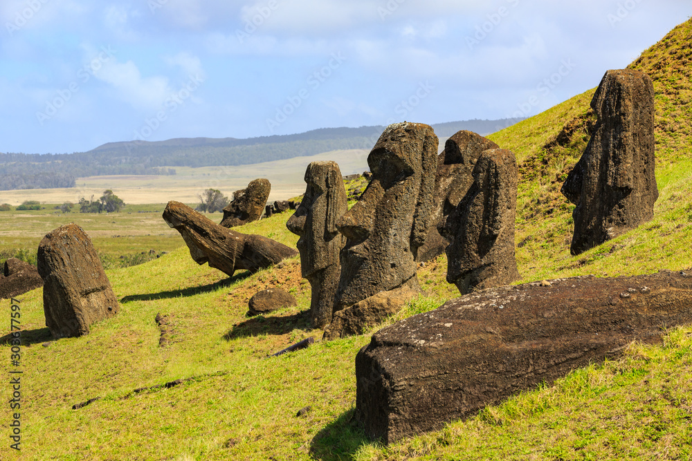 Moai statues in the Rano Raraku Volcano in Easter Island, Rapa Nui National Park, Chile