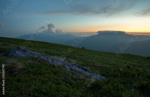 sunset in the mountains of flowers  stones and sun