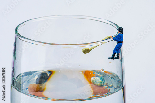 mini figure firefighter on drinking glass