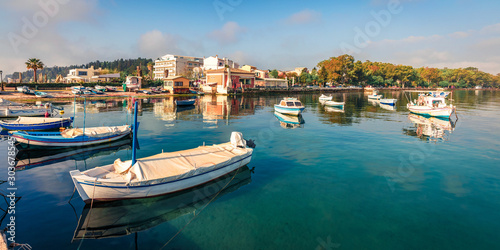 Bright panoramic view of old Kerkira port, capital of Corfu island, Greece, Europe. Sunny summer seascape of Ionian sea. Traveling concept background.