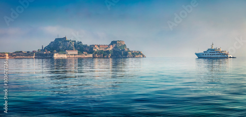 Panoramic morning view of old Venetian fortress in Kerkira, capital of Corfu island. Incredible summer seascape of Ionian Sea, Greece, Europe. Traveling concept background.