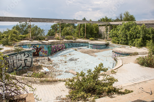 Krk, Croatia, July 12 2019: Abandoned and destructed luxury hotel Palace Haludovo in Malinska, Island of Krk, Croatia. In 1970's and 1980's it was the most exclusive hotel in Eastern Europe. photo