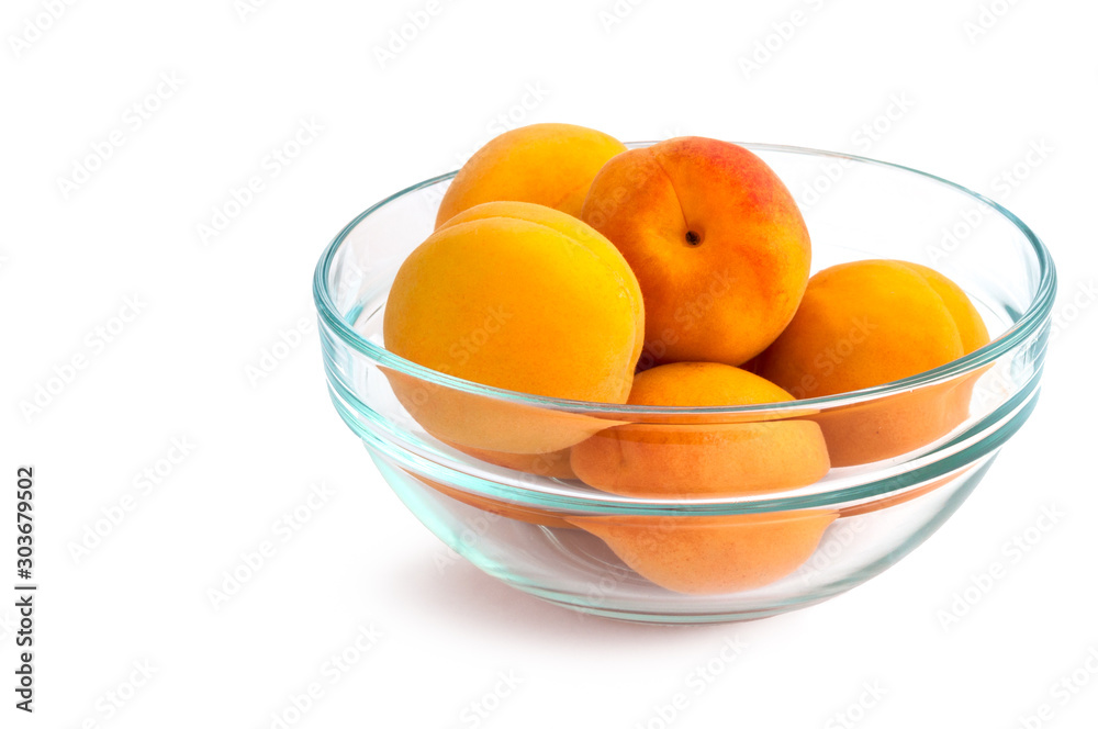 Apricot. Ripe Organic Apricots in blue transparent plate. Isolated on white background. Apricot. Ripe Organic Apricots in blue transparent plate. Isolated on white background.
