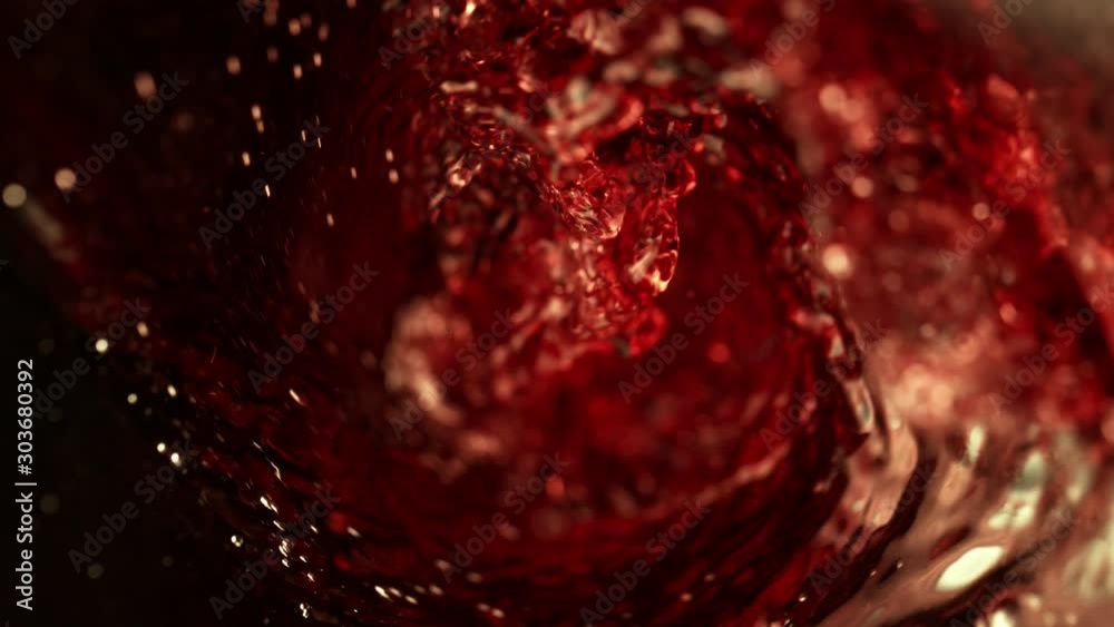 Super slow motion of pouring red wine, inside bottle view. Filmed on high speed cinema camera, 1000 fps.