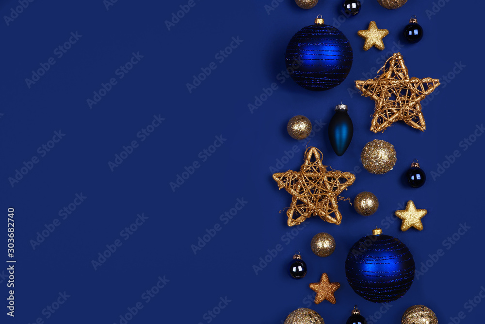 Christmas side border of dark blue and gold ornaments. Top view on a  midnight blue background. Stock Photo | Adobe Stock
