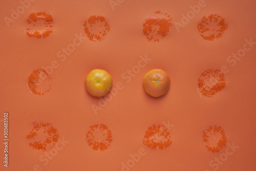 Fruit pattern of orange slices on orange background. Flat lay, top view. Food background
