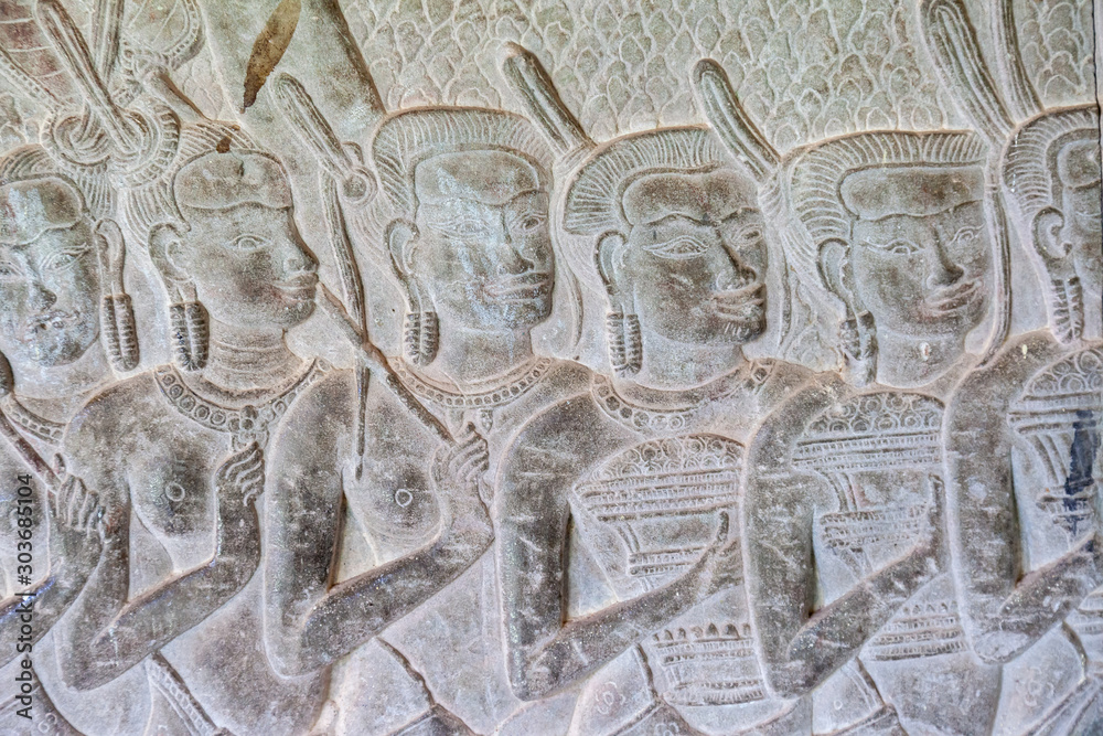 Relief carving in stone at Angkor Wat, Siem Reap, Cambodia. Nice detail on this story told a couple of meters long on the walls.