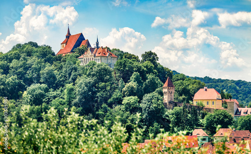 Picturesque morning cityscape of Sighisoara. Sunny summer view of medieval town of Transylvania, Romania, Europe. Traveling concept background.