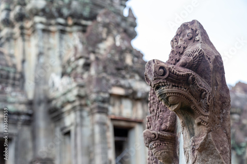 The head of a snake guarding the entrance to the temple. Siem Reap, Cambodia has a huge variety of different temples from different centuries.