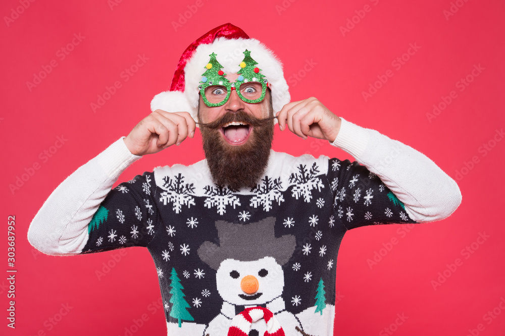 Arrive in style to Chritmas events. Bearded man in santa claus style. Happy hipster twirl mustache. Festive holiday style. Christmas and new year celebration. Fashion for winter. Celebrate in style