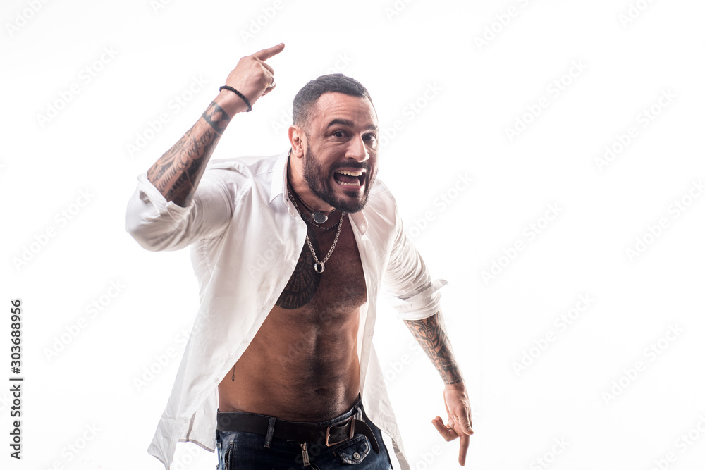 Fotografie Young handsome hipster bearded guy looking brutal