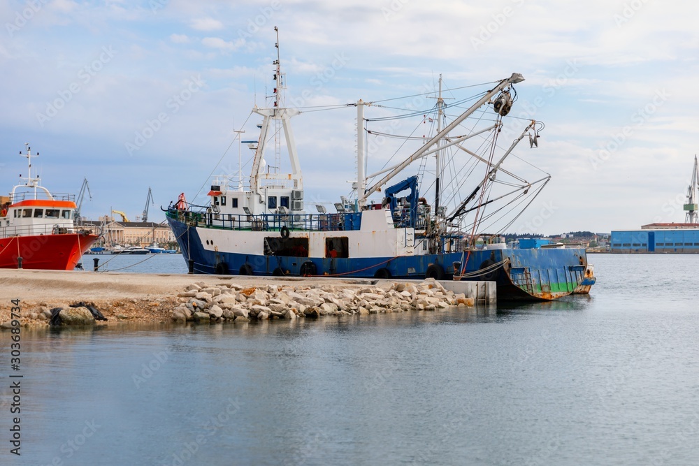 Old fishing boat anchored in the port