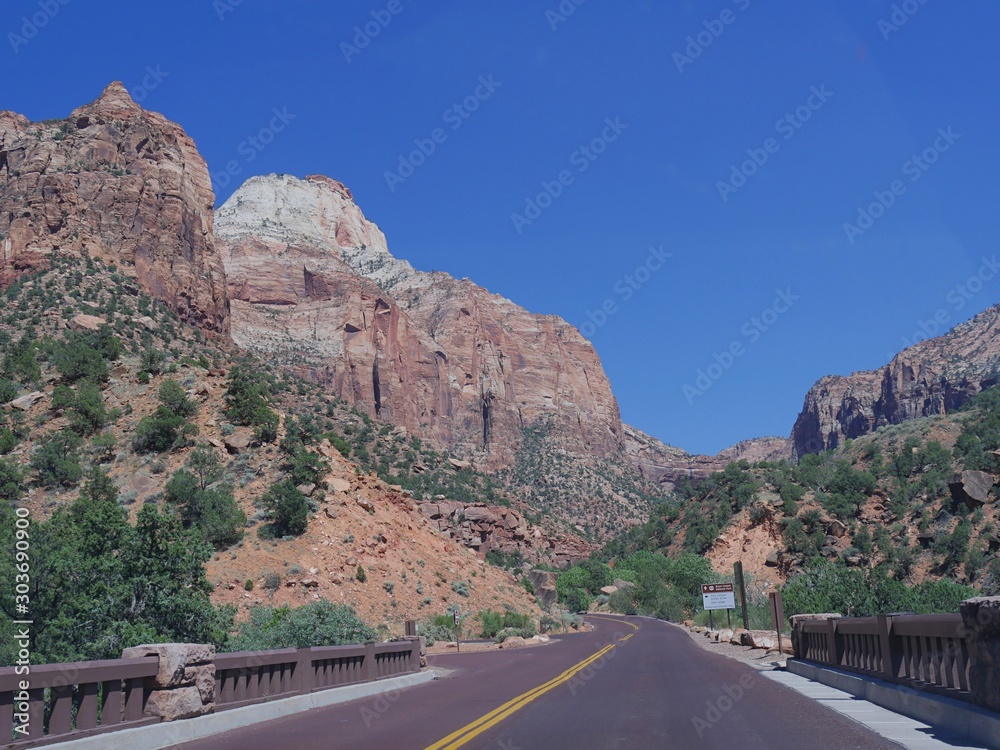 Winding road with breathtaking landscape and mountain peaks at Zion National Park, Utah, USA.