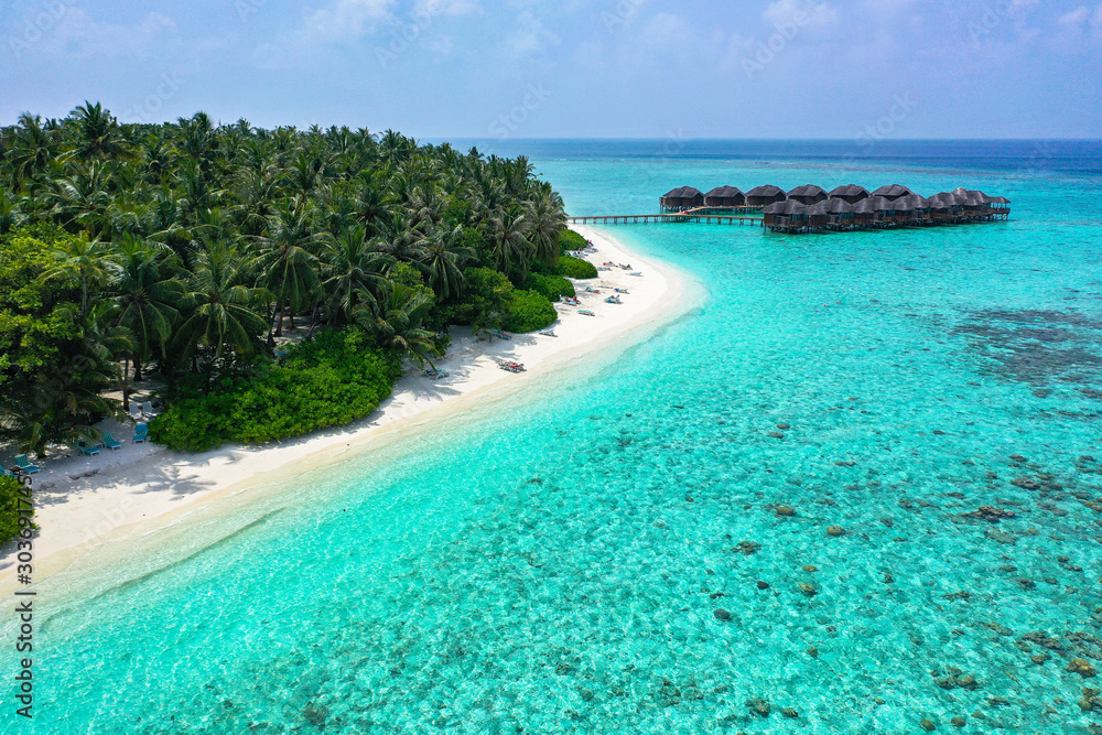 Aerial view with drone of an tropical exotic island paradise with turquoise crystal clear water and pure white sand beach