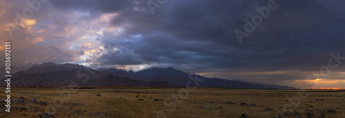 foothills at sunset, mountain ranges of Kyrgyzstan photo
