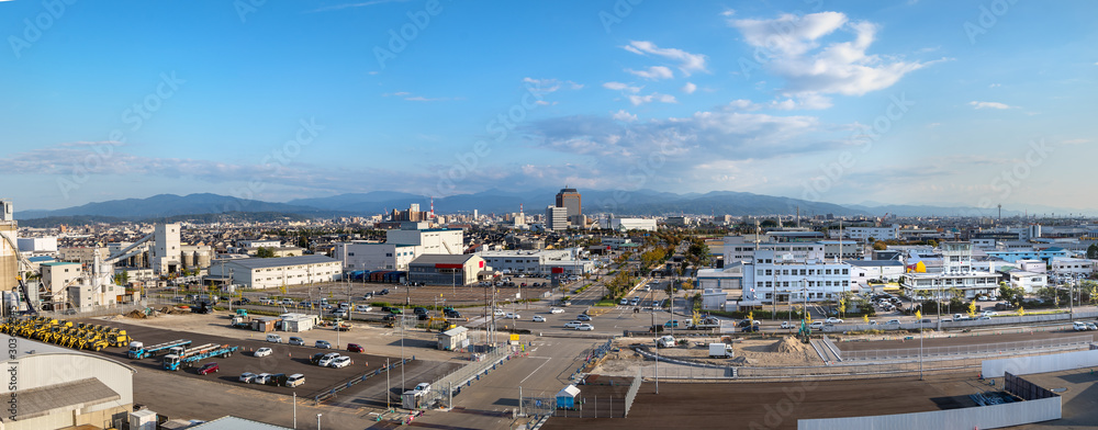 Panorama of the city of Kanazawa around the port view from a ship, Japan.
