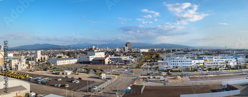 Panorama of the city of Kanazawa around the port view from a ship, Japan.