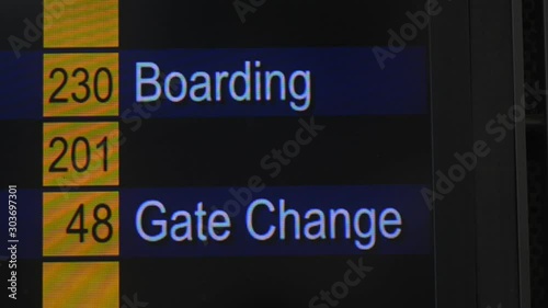 Boarding status gate change on airport table. international flight departure schedule. display terminal. screen animation in aeroport. information changing. air plane chart