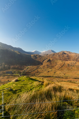 Beautiful mountains in Autumn Fall, snow on peak.