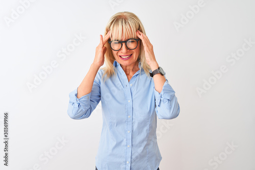 Middle age businesswoman wearing elegant shirt and glasses over isolated white background with hand on headache because stress. Suffering migraine. © Krakenimages.com