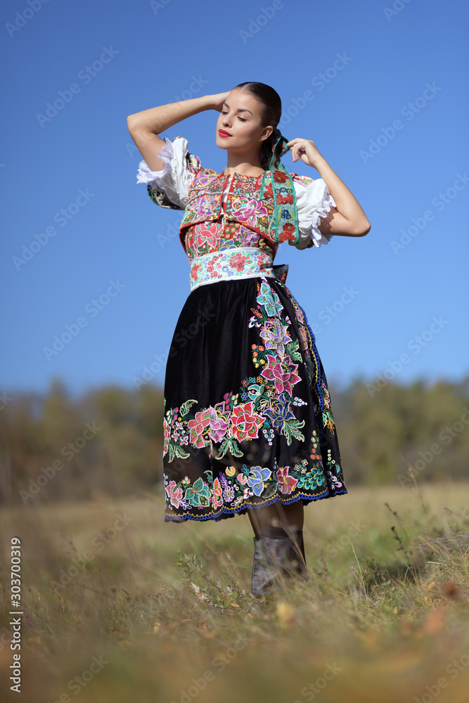 Beautiful woman wearing traditional slovak folk costumes. .