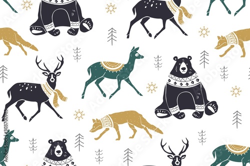 Seamless winter pattern with forest animals reindeer  fox  bear. Scandinavian style. Silhouettes of wild animals in scarves with ornaments. Christmas background.