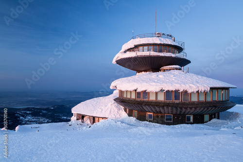 Building at the top of the Snezka mountain in the evening light