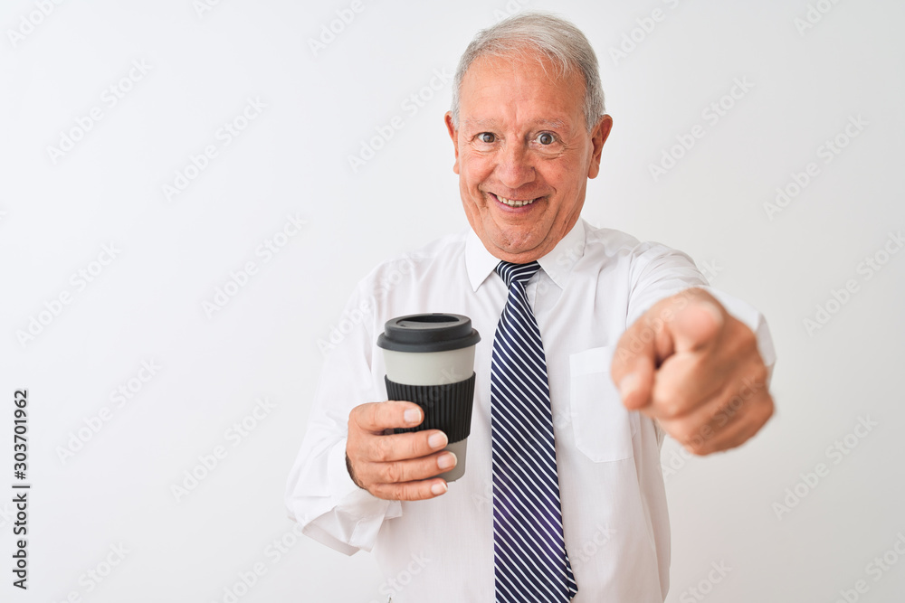 Senior grey-haired businessman drinking take away coffee over isolated white background pointing with finger to the camera and to you, hand sign, positive and confident gesture from the front Senior grey-haired businessman drinking take away coffee over isolated white background pointing with finger to the camera and to you, hand sign, positive and confident gesture from the front