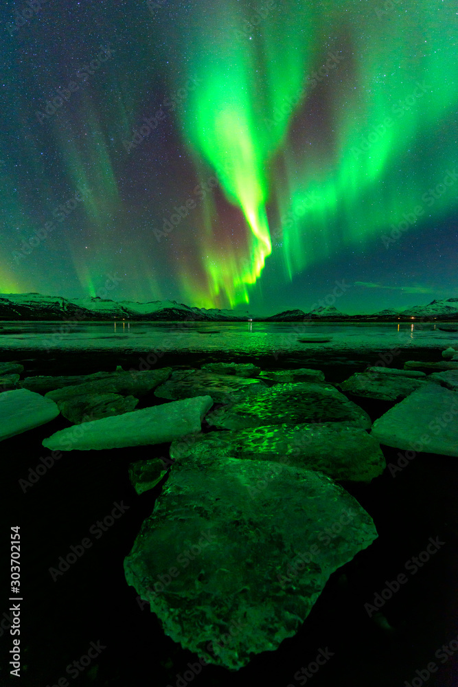 A wonderful night with Kp 7 northern lights flying over the Glacier Lagoon in iceland
