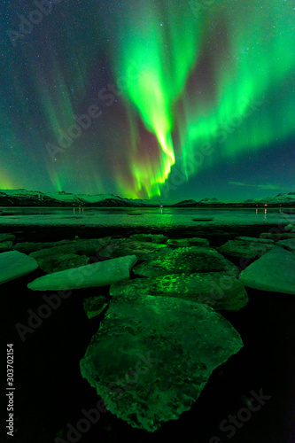 A wonderful night with Kp 7 northern lights flying over the Glacier Lagoon in iceland © JKLoma
