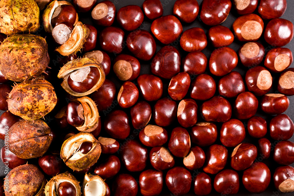 Background of peeled and unpeeled chestnuts. Top view. Background of peeled and unpeeled chestnuts. Top view.
