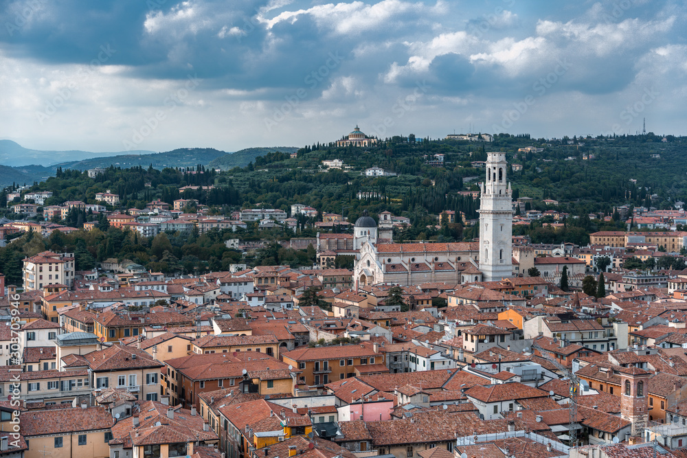 Top view of red brick city skyline and Verona Church from torre dei lamberti tower in Verona, Italy