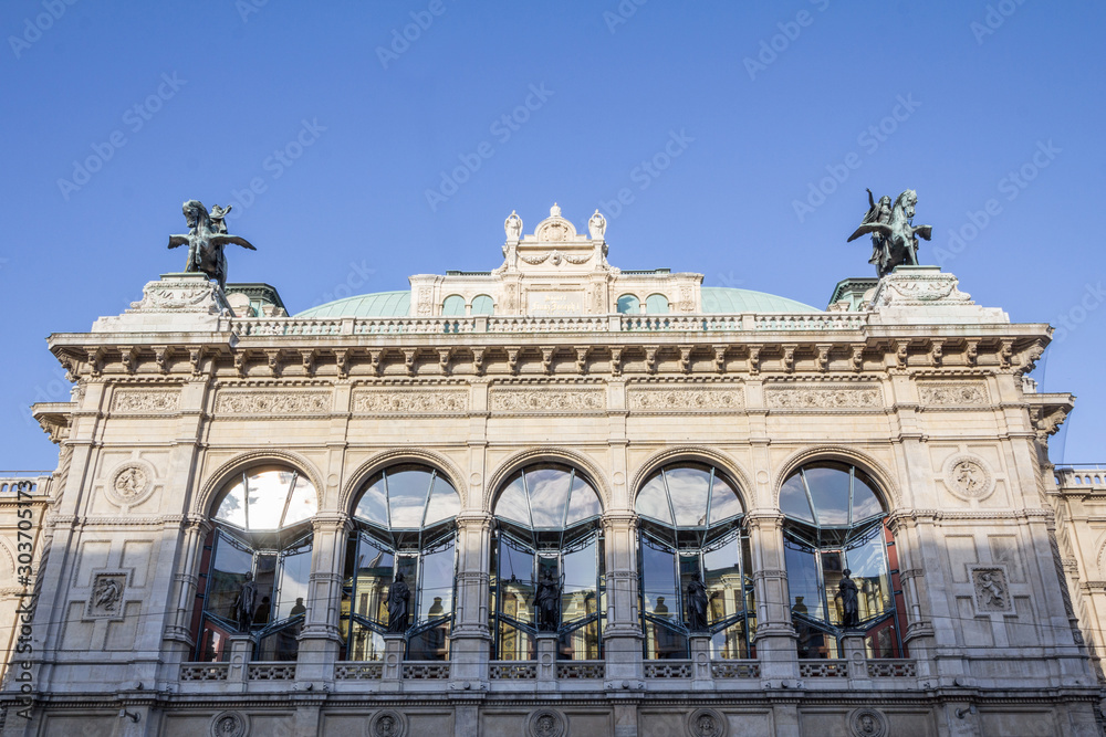 Obraz premium Main baroque facade of the Vienna Opera House, also called wiener staatsoper, in Vienna, Austria. It is an imperial austro hungarian landmark, and the main state opera of the Austrian capital city.