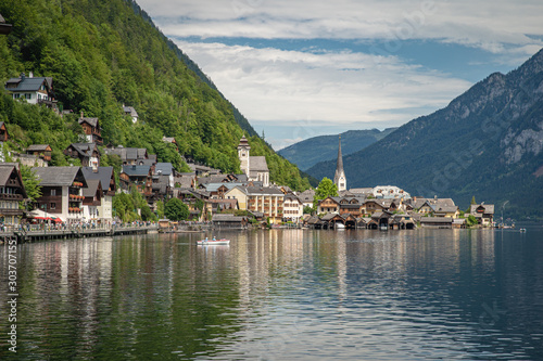 View on lake in austrian town hallstatt during tourist season in summer © edojob