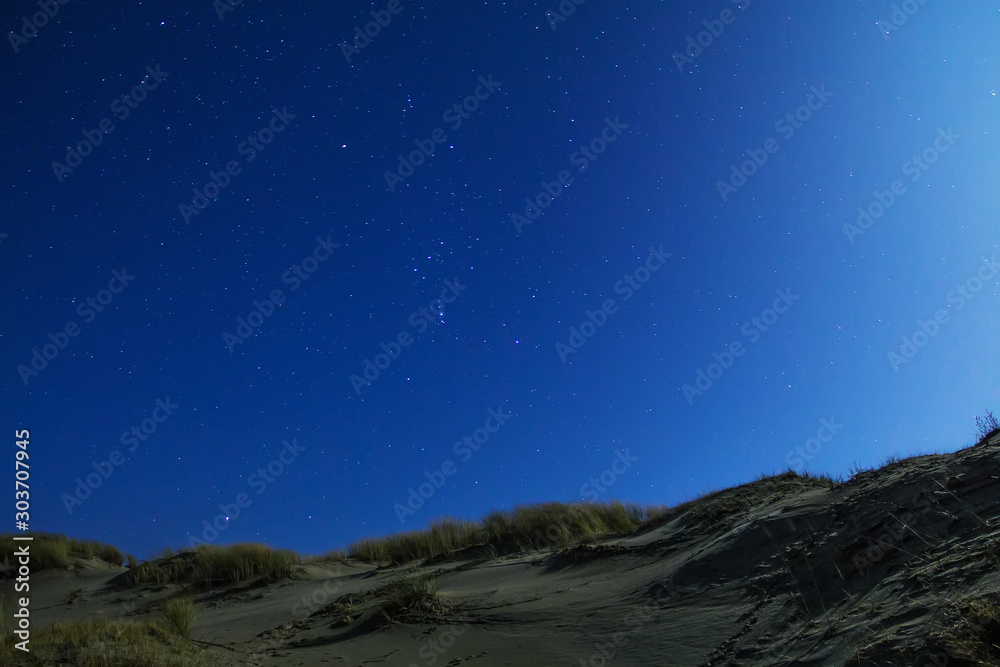 starry sky over the dunes night