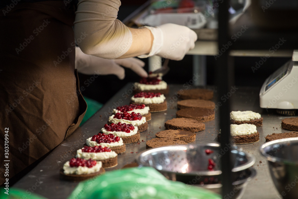 preparation of cakes with cream and berries, preparation of cakes with cream and berries,