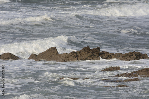 Fototapeta Naklejka Na Ścianę i Meble -  Waves beating against the rocks at Vidiago beach in Asturias