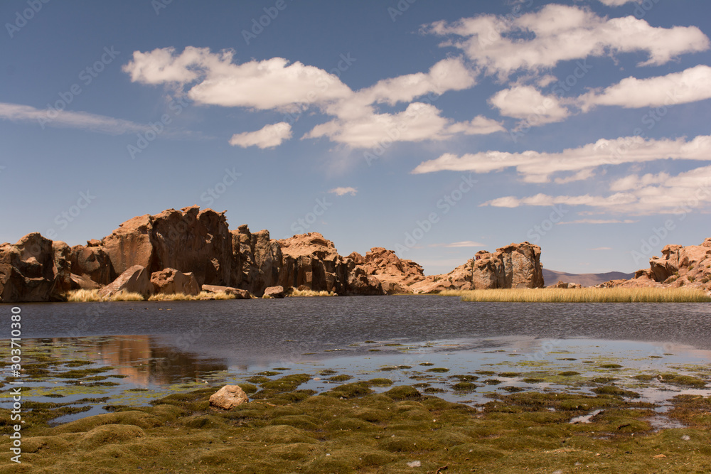 Hidden lagoon Bolivian altiplano, beautiful place in the middle of a valley of stones Hidden lagoon Bolivian altiplano, beautiful place in the middle of a valley of stones