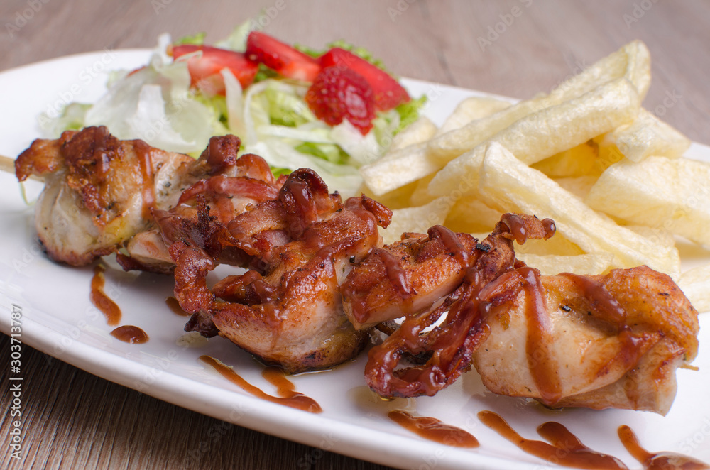 pork in sauce accompanied by vegetables and potatoes pork in sauce accompanied by vegetables and potatoes