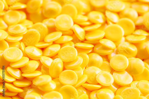close up of yellow industrial plastic pellet background