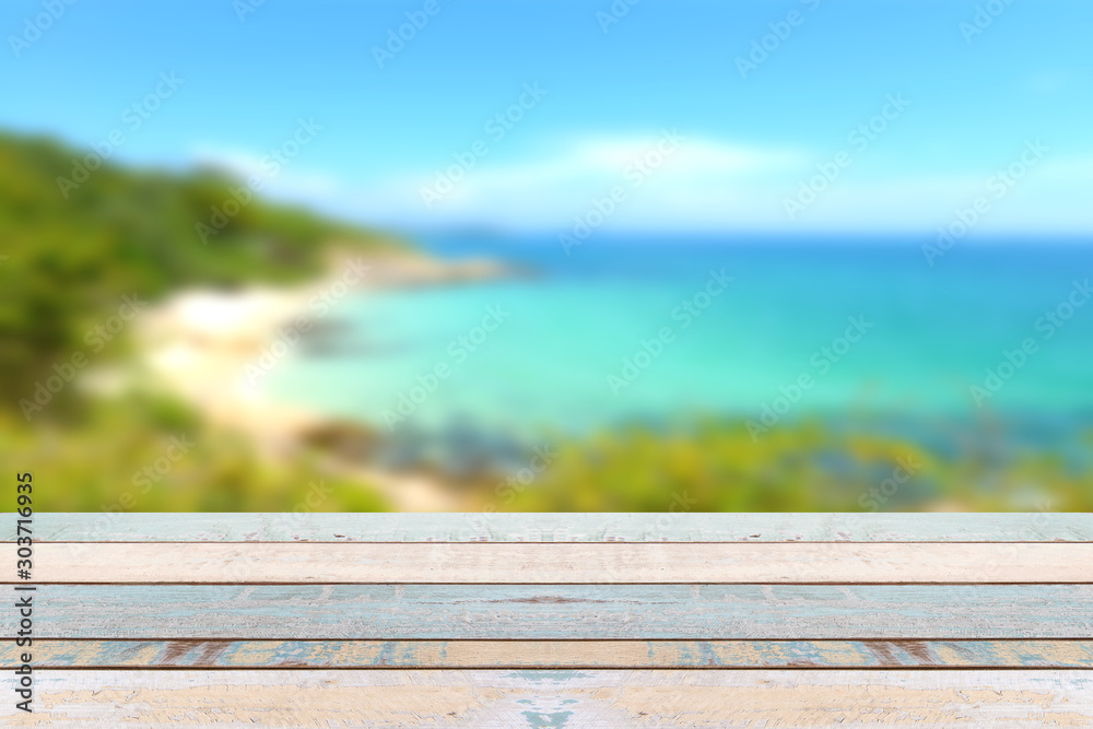 Wood table top with blurred nature scene tropical beach Wood table top with blurred nature scene tropical beach
