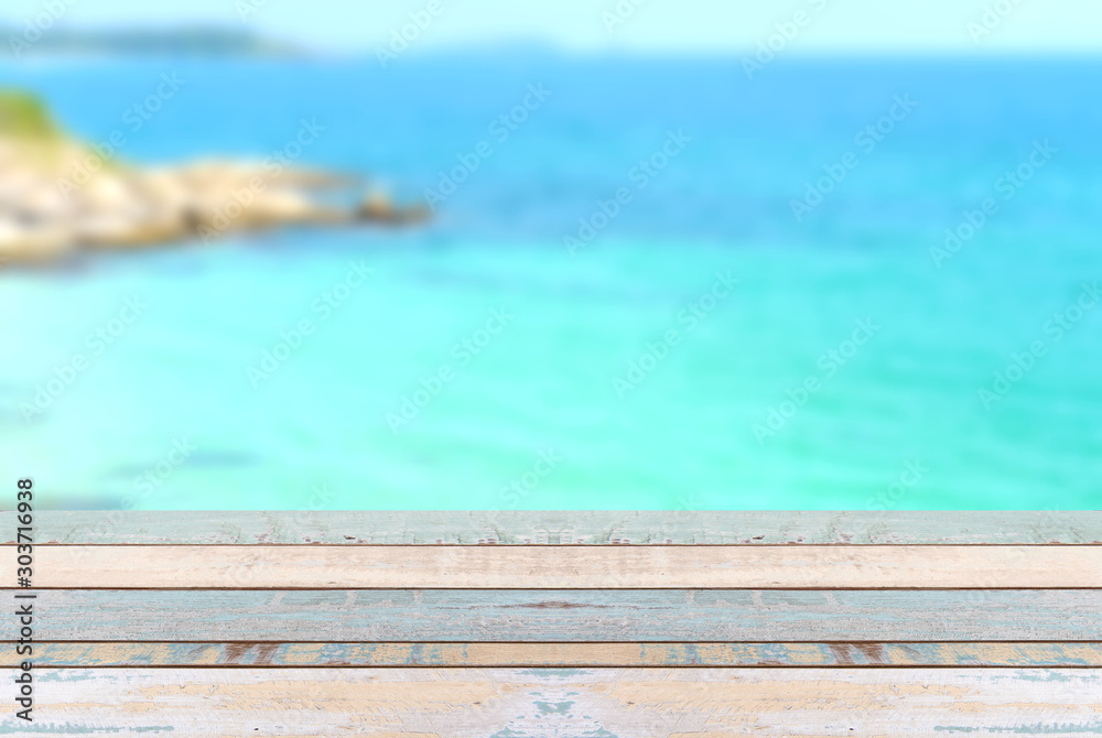 Wood table top with blurred nature scene tropical beach Wood table top with blurred nature scene tropical beach